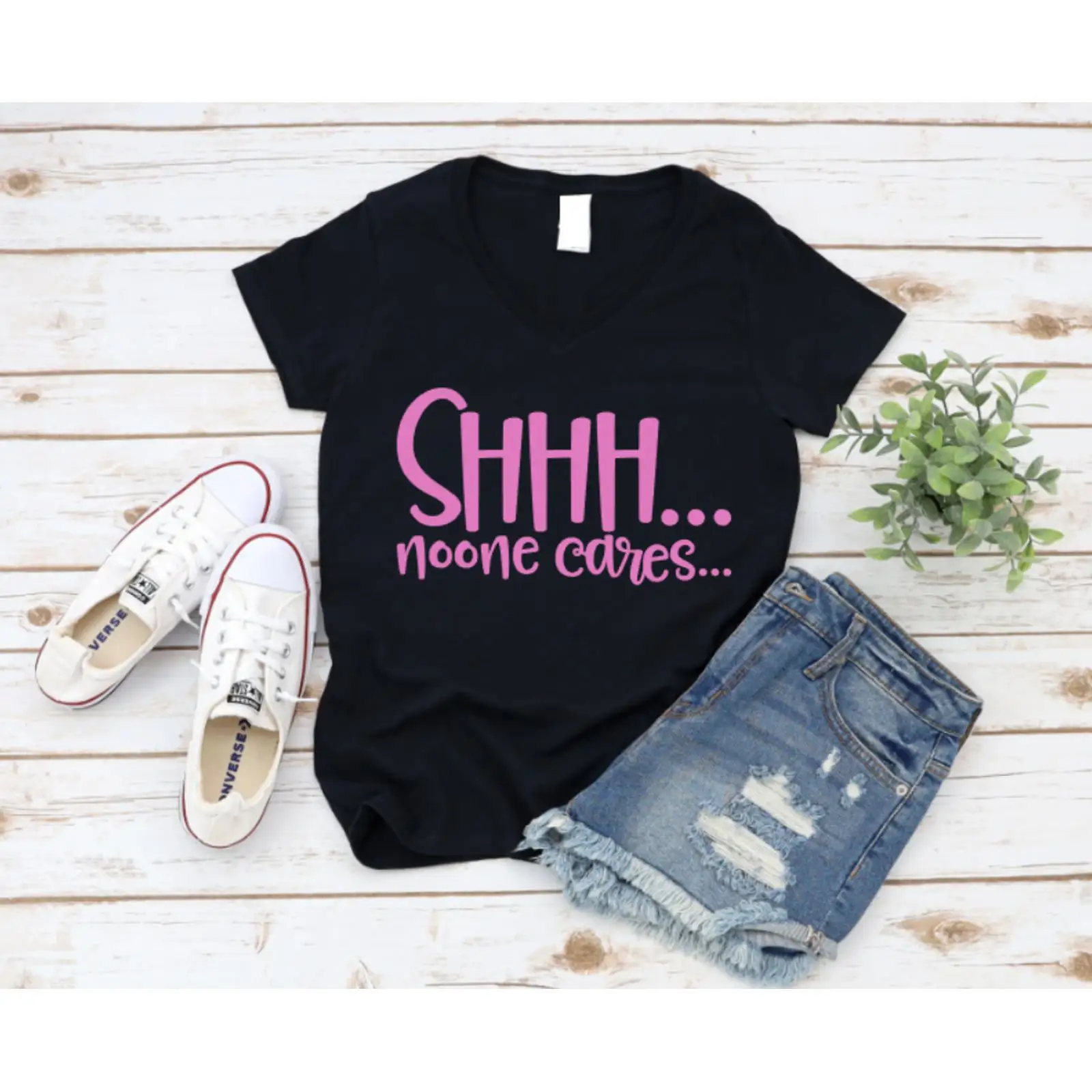 Black t shirt with pink text ' - On Sneaker Care review and price